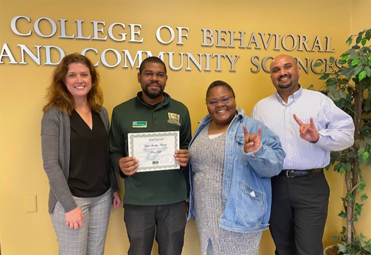  Dr. Jennifer Lister, Eric Hill, Sclafani Louis-Jeune, and Stefan Phekoo posed for a photo