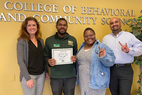Dr. Jennifer Lister, Eric Hill, Sclafani Louis-Jeune, and Stefan Phekoo posed for a photo