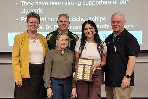 Julia Mikhail and Brittany Probus receive scholarships from the Sertoma Club