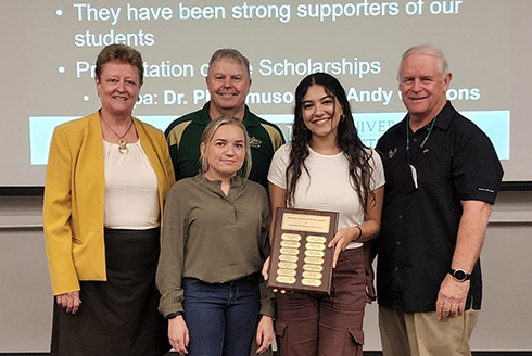 Julia Mikhail and Brittany Probus receive scholarships from the Sertoma Club 