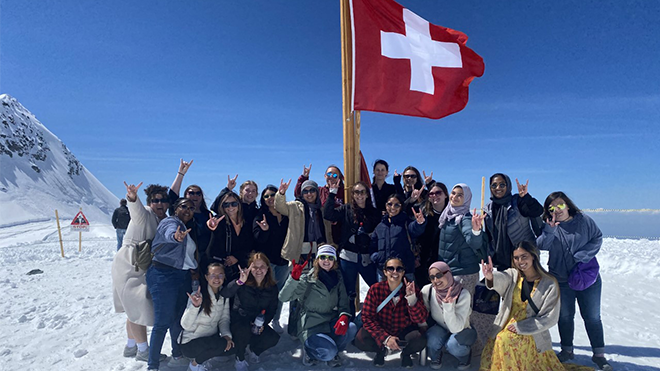 Students in the USF Switzerland Linguistic and Cultural Diversity program walk on a mountaintop near the Aletsch Glacier