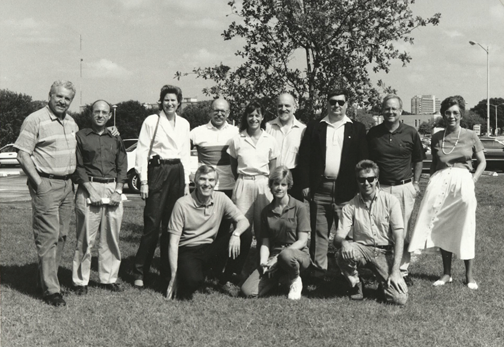 Group of criminology faculty members standing outside at a tree dedication