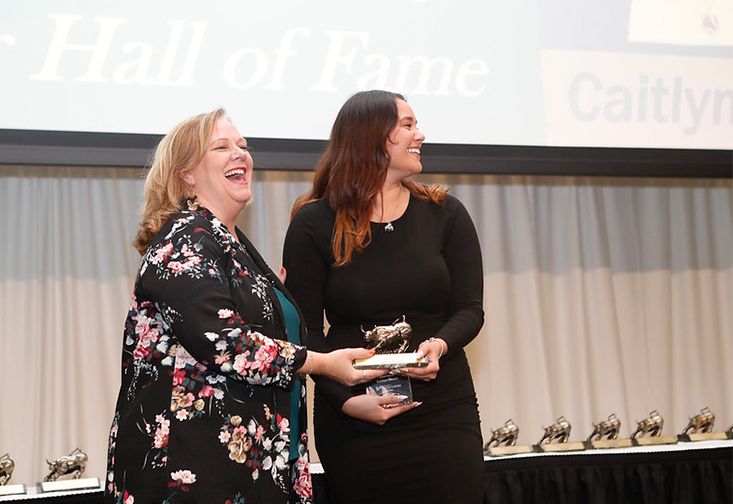 Caitlyn Deam accepts her award