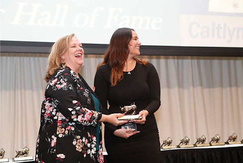 Caitlyn Deam accepts her award