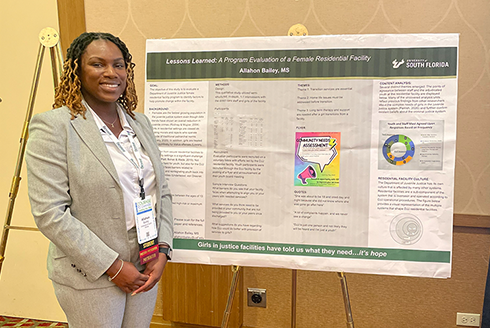 Allahon Bailey presents her poster at the symposium