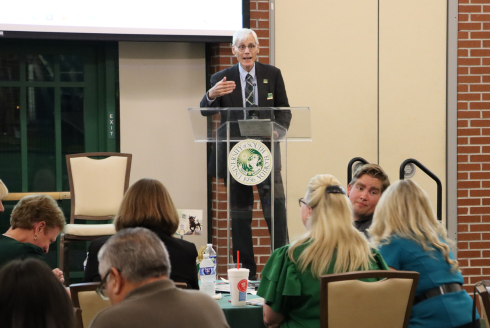 Dr. Greg Teague speaks from a podium at the Behavioral Healthcare 10 year anniversary celebration