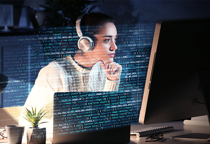 Young woman working with computer at table