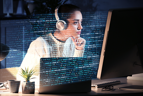 Young woman working with computer at table