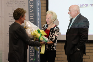 Mary Armstrong and Roger Boothroyd are recognized for their gift at a recent FMHI event.