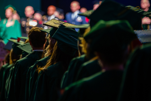 Students in their caps and gowns during a graduation ceremony