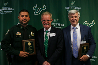 Max Bromley attends the 2022 Wall of Fame Ceremony with inductees Nick Markese and Robert Johnson