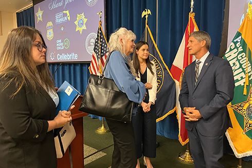 Joan Reid and Kailey Pate Carter speak with Congressman Franklin