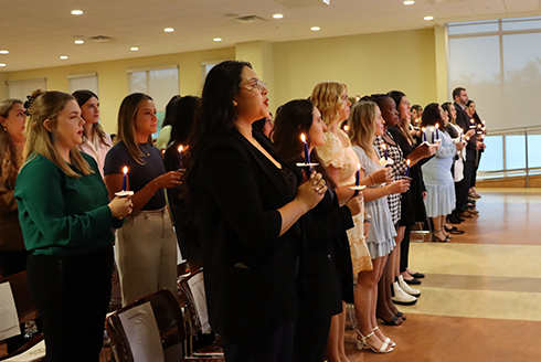 students are inducted into Alpha Phi Sigma