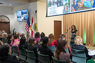 Madison Dowdy speaks to a crowd