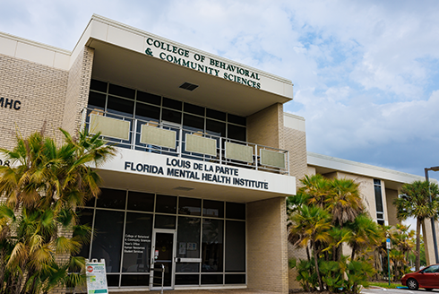 The front of the College of Behavioral and Community Sciences building.