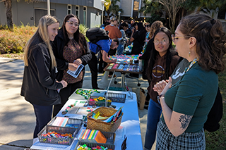 Lou Hernandez speaks with students