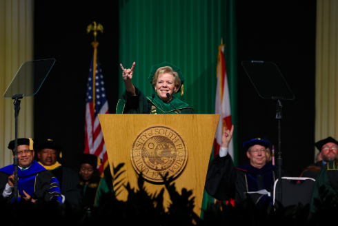 USF President Rhea Law gives a bulls hand gesture at commencement