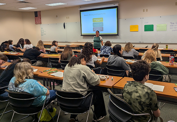 Cary Hopkins Eyles speaks to a room of students