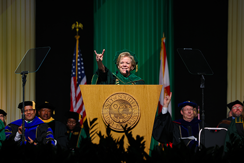 USF President Rhea Law gives a bulls hand gesture at commencement