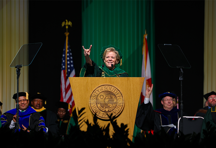 USF President Rhea Law gives a bulls hand gesture at commencement