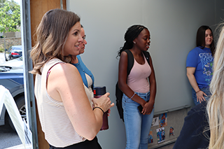 faculty and students inside the model prison cell