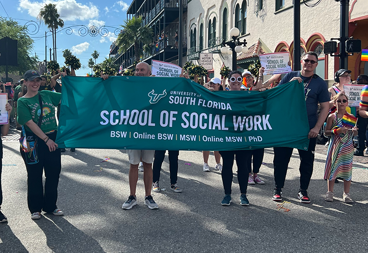 USF School of Social Work representatives walk in the parade
