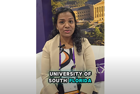 Manninkattil (Sri) Unni sitting on couch with University of South Florida text in front of her