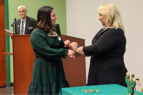 Student receives pin