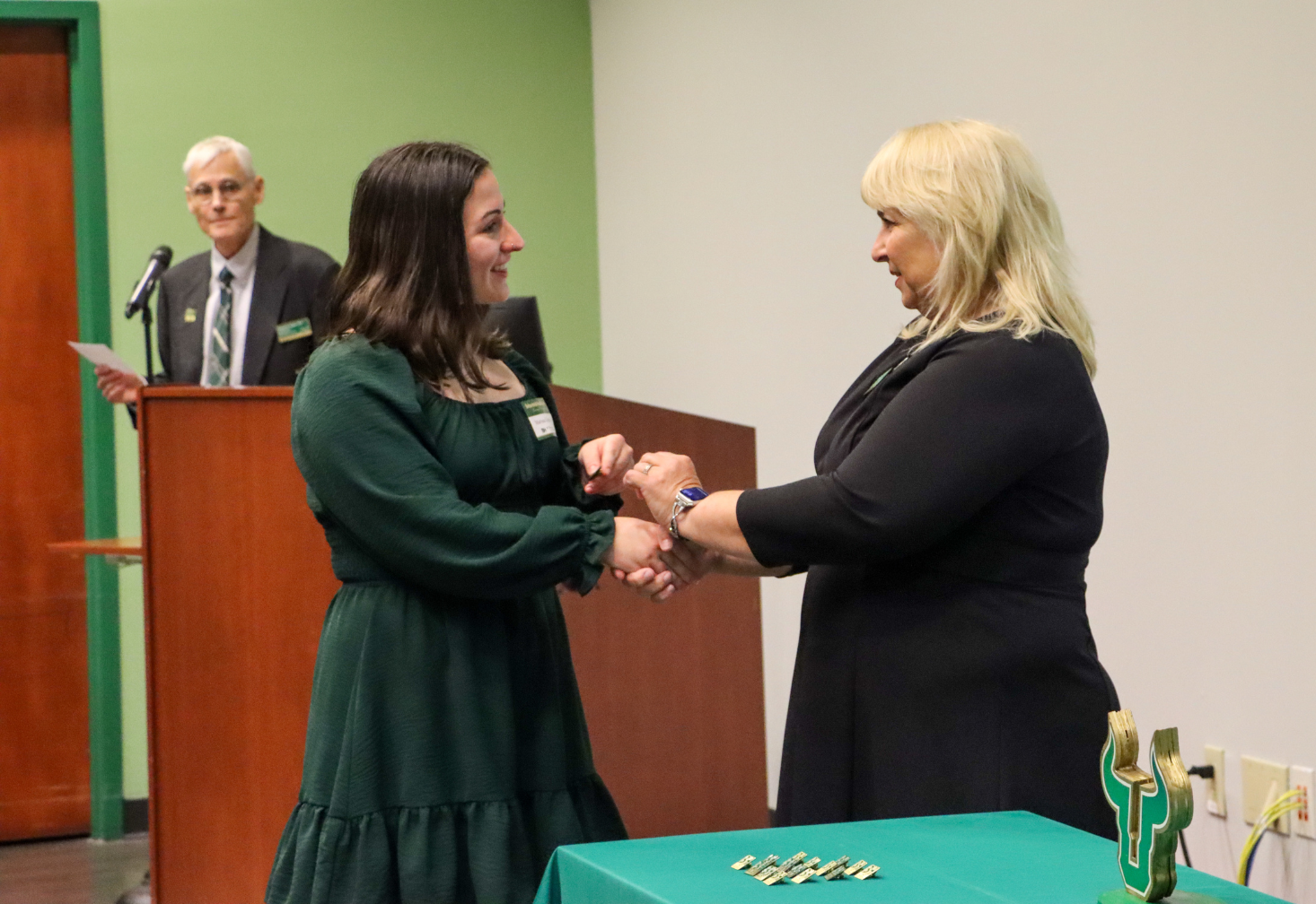 Student receives pin