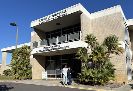 Haggler and Ellenberg in front of the CBCS building