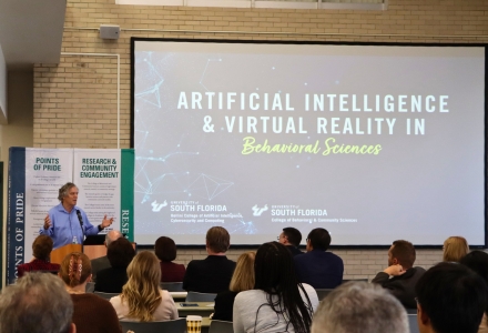 Lawrence Hall at the podium speaking