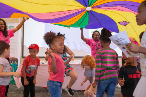 Children joining in a group activity