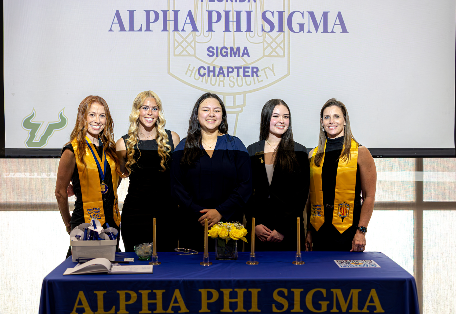 Group of students at the Alpha Phi Sigma induction ceremony