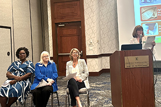 Lindsay Peterson leads a panel discussion