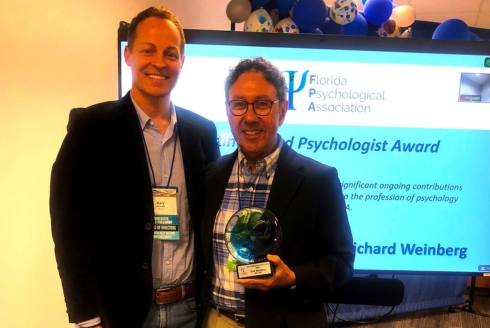 Rick Weinberg with Gary Howell receiving his FPA award