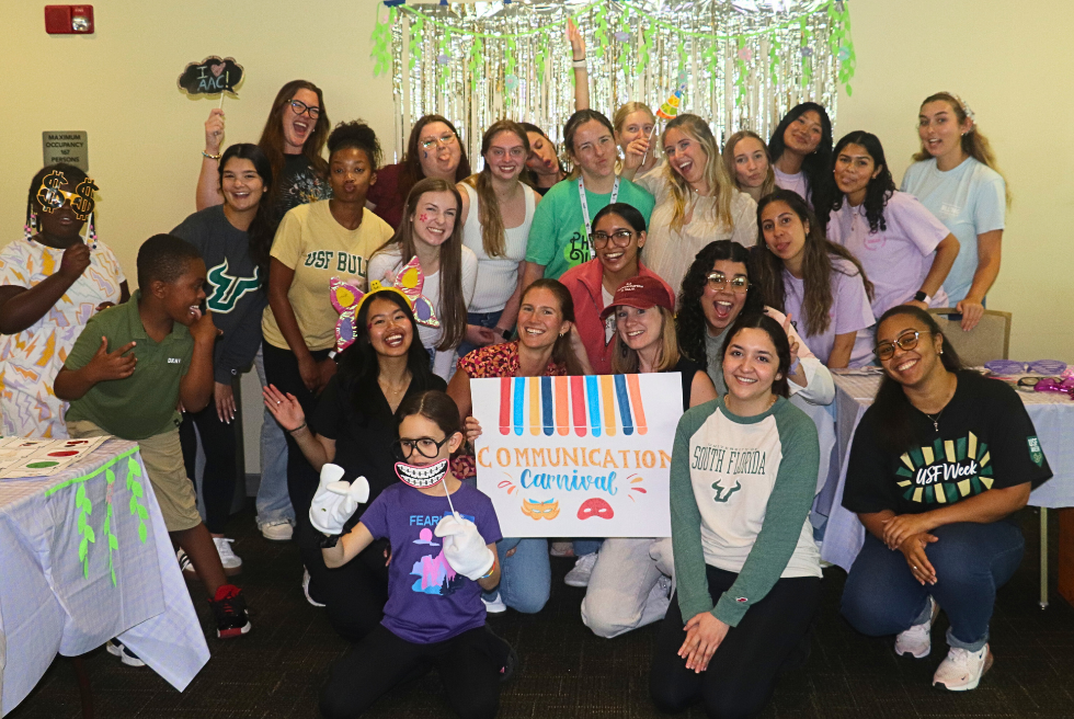 SLP graduate students, families and children at the Communications Carnival