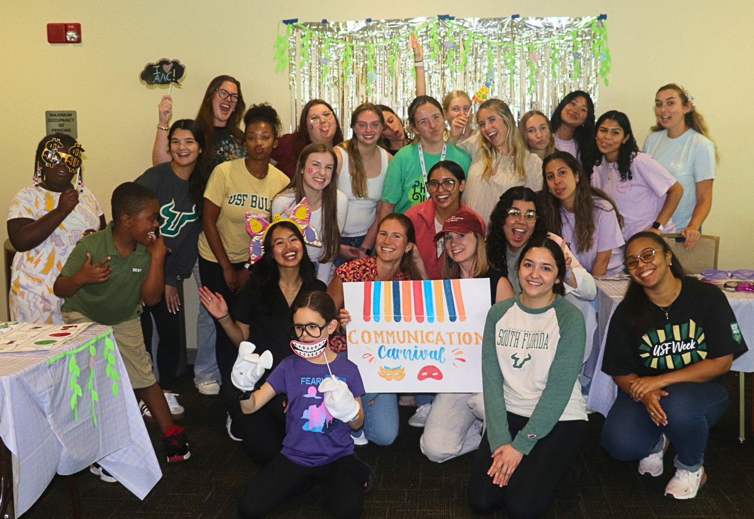SLP graduate students, families and children at the Communications Carnival