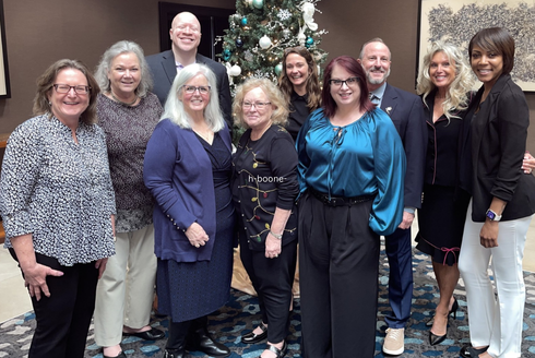 Beth Boone takes a group photo with members of the Disability Rights Florida Board of Directors