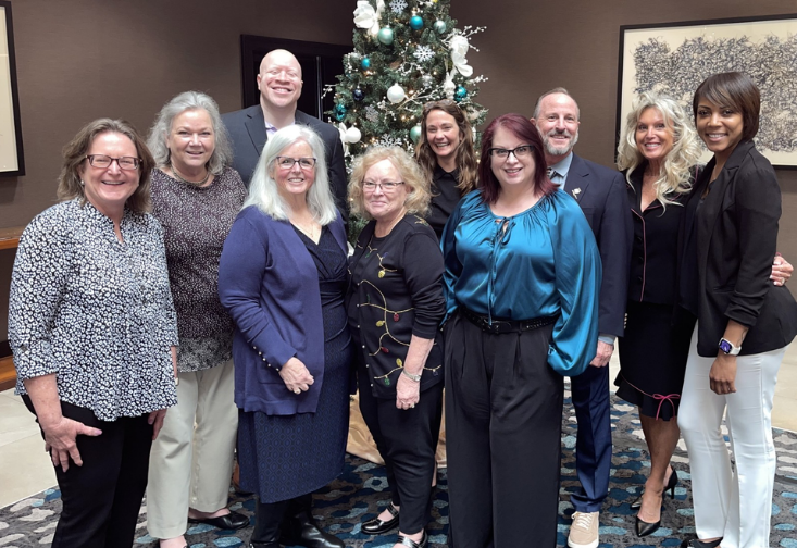 Beth Boone takes a group photo with members of the Disability Rights Florida Board of Directors