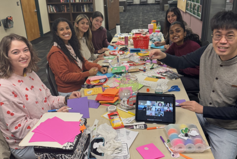 Students gathering together to make Valentine's Day cards 