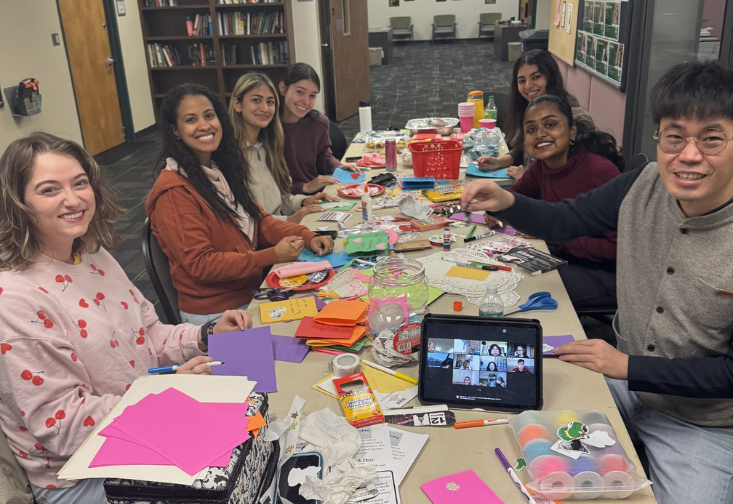 Students gathering together to make Valentine's Day cards 