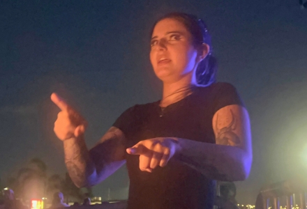 Carly Missildine provides ASL interpretation during a concert performance at MIDFLORIDA Credit Union Amphitheatre.
