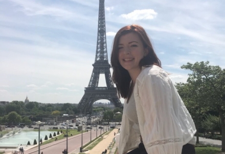 Emily Hutchinson in front of the Eiffel Tower