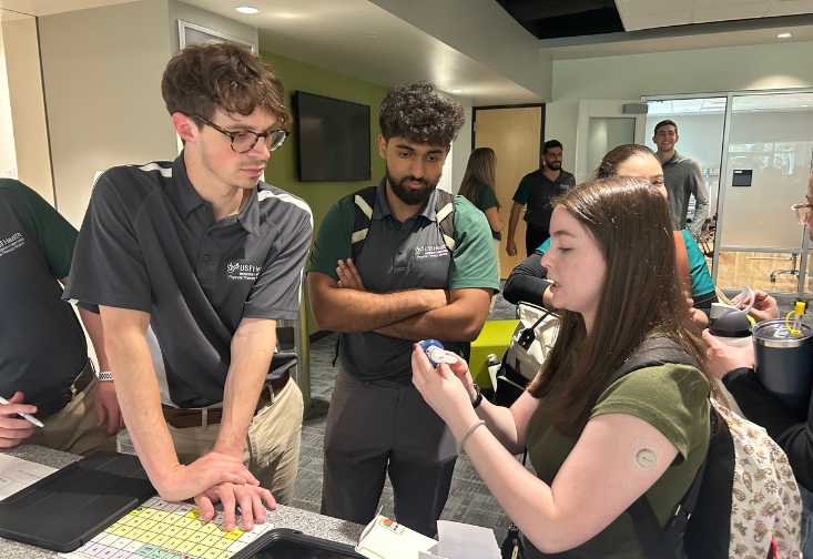 Students collaborating at the IPE event