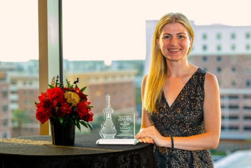 Nik Lampe with their award