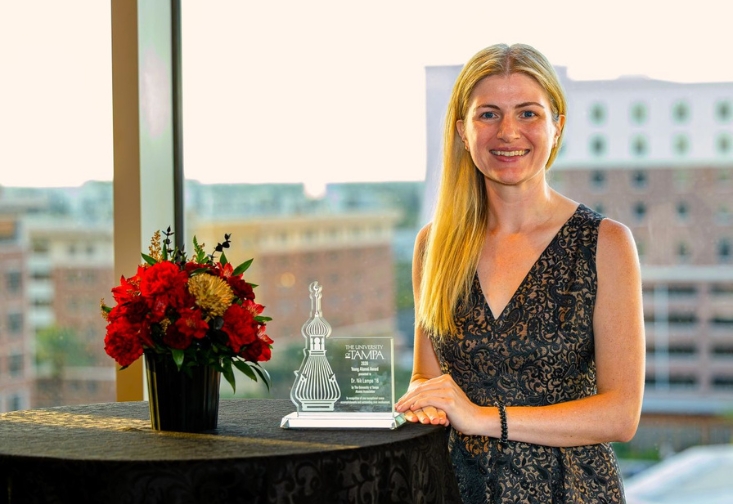 Nik Lampe with their award