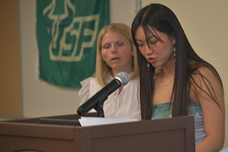 Chapter President Elaina Hawkins speaks