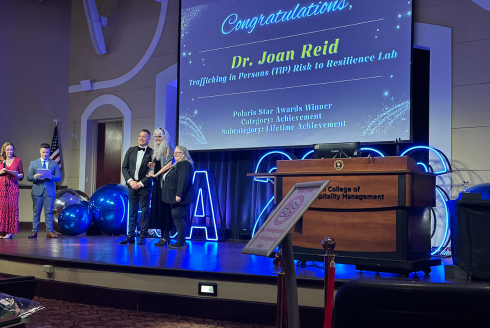 Joan Reid receiving her award