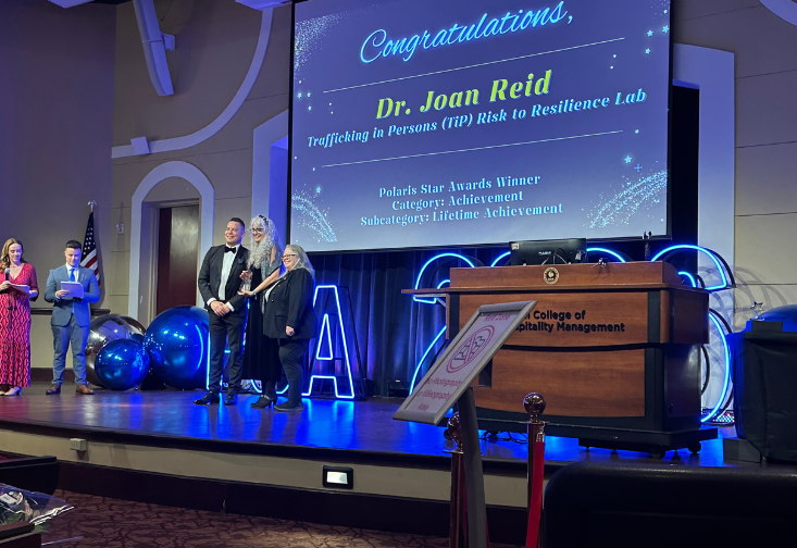 Joan Reid receiving her award