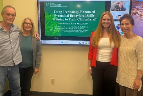 A student with her dissertation committee